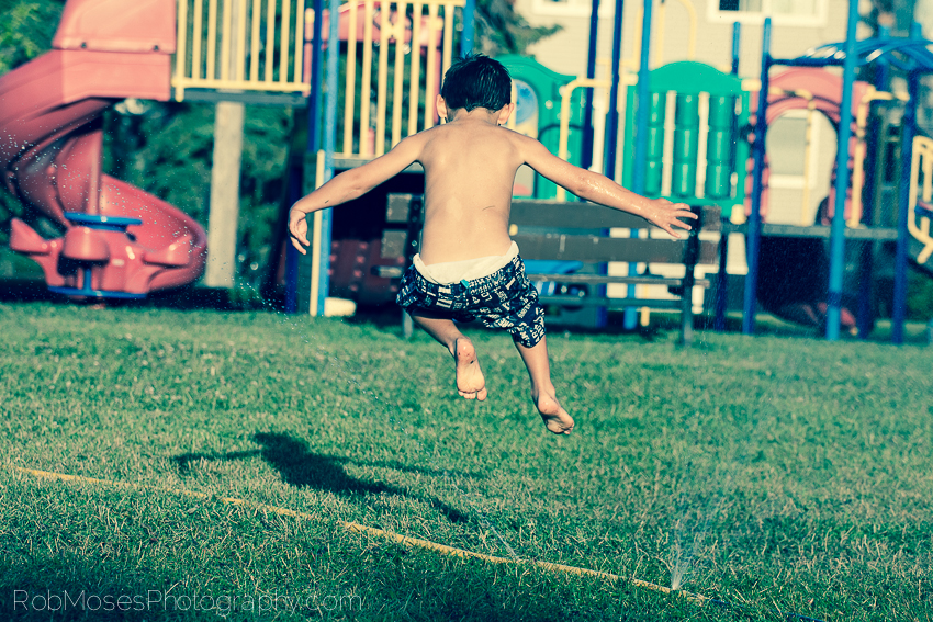 Boy Playing Spinkler Summer Child jumping - Rob Moses Photography 3