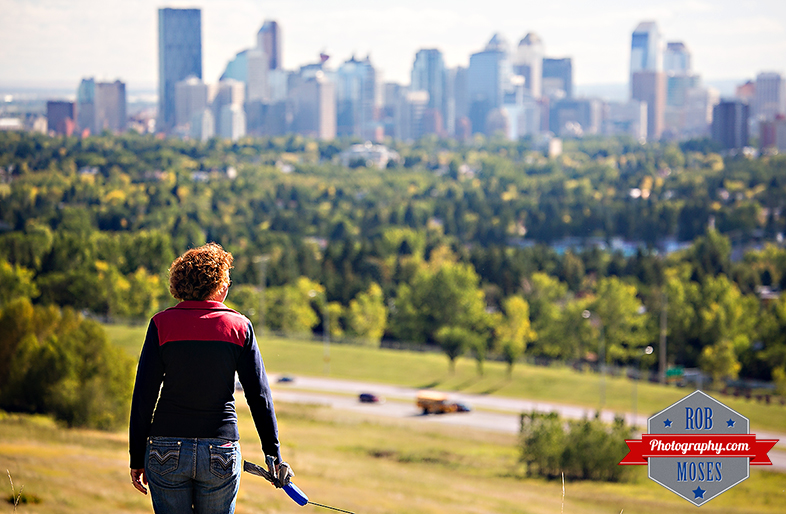 Woman walking dog famous nose hill park Calgary alberta Canada yyc skyline city urban - Rob Moses Photography - Photogapher