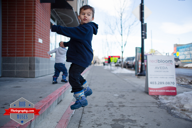 Children boys kids fun Calgary Winter Bridgeland yyc excited fun jumping running yahoo - Rob Moses Photography - Family-8
