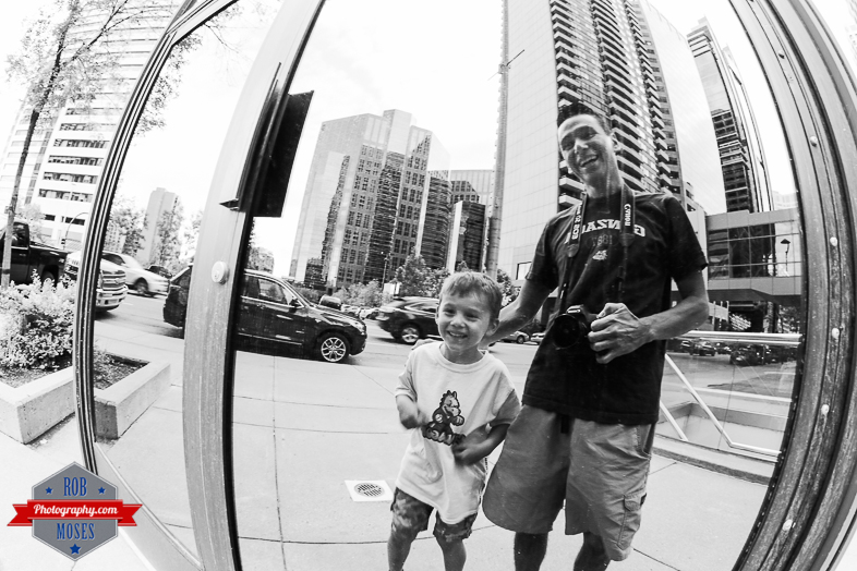 Father son moment laugh smile fun love urban city fisheye yyc dad Canon - Rob Moses Photography - Vancouver Seattle Calgary Photographer Photographer Native American Famous Tlingit Ojibawa Top Popular Best Canadian Lifestyle