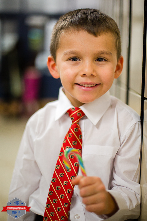 7 Child kid Christmas concert Flames tie cute - Rob Moses Photography - Calgary Photographer Photographers Native American Famous un celebrity Tlingit Ojibawa Top Popular Best Good Canadian