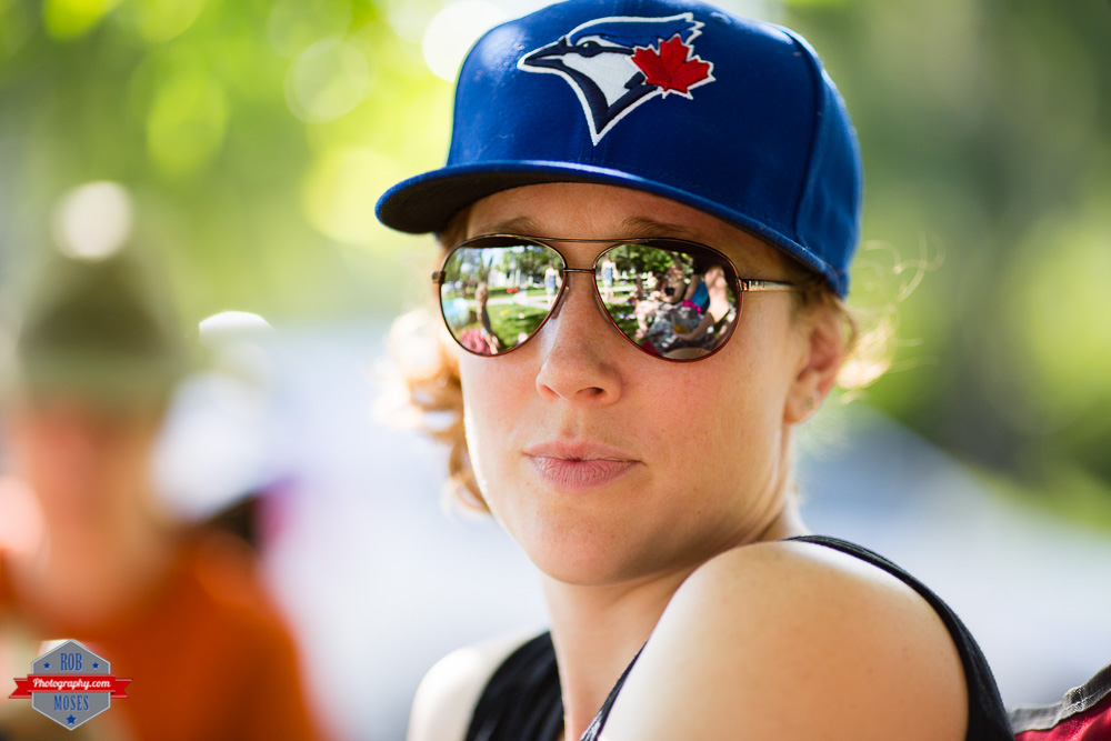 Neighbor woman girl Toronto Blue Jays baseball hat bokeh shades reflection - Rob Moses Photography Calgary Photographer Photographers Native American Famous un celebrity Tlingit Ojibawa Top Popular Best Good Canadian