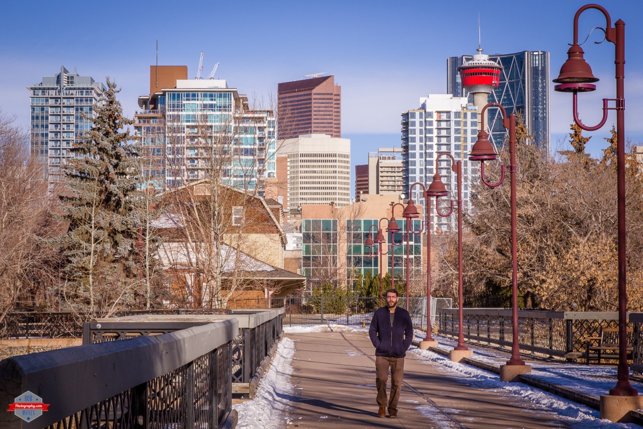 YYC bridge city buildings winter sky street man walking tower sunny Rob Moses Photography Calgary Vancouver Seattle Spokane Photographer WA BC Native American Tlingit Ojibaway famous un celebrity Canadian best