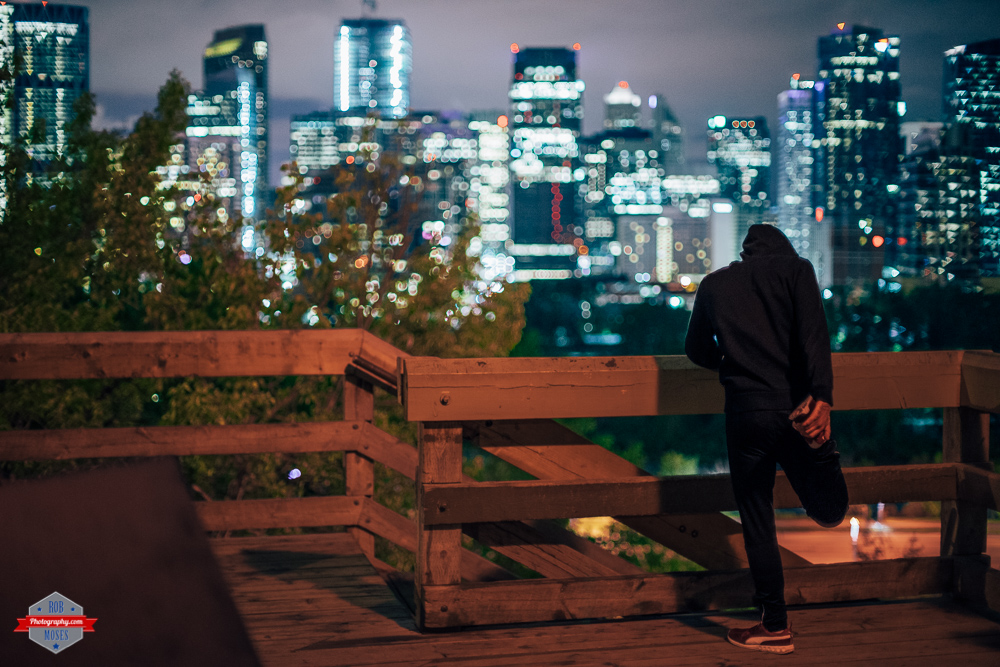 Night runner stretching calgary city skyline urban bokeh a7ii canon fd 50mm 1.2 Rob Moses Photography Portland Calgary Vancouver Seattle Spokane Photographer WA BC Native American Tlingit Ojibaway famous un celebrity Canadian best pdx-9